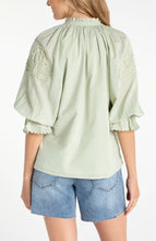 Back view of a woman wearing a light green Matcha 3/4 Sleeve Button-Front Woven Top With Embroidery by liverpool
