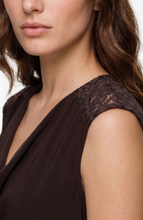 Close-up of a woman wearing Java Lace Trim Tank with delicate lace detail on shoulder by liverpool in dark brown.