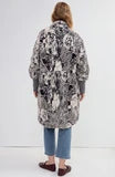 Liverpool Cardigan Sweater by Liverpool in a long patterned style shown from the back with jeans and heels