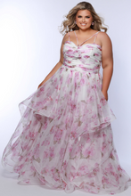 Sydney's Closet Prom Dress Style SC7418 in pink floral with layered skirt and delicate straps on model size 14