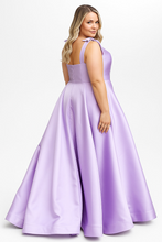 Woman wearing Sydney's Closet Prom Dress Style SC7444 in lilac with tie straps and full satin skirt by sydneys closet