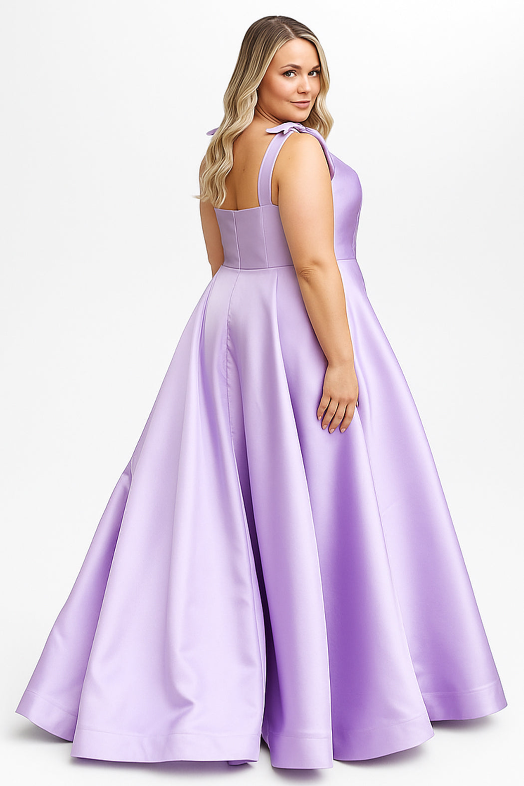 Woman wearing Sydney's Closet Prom Dress Style SC7444 in lilac with tie straps and full satin skirt by sydneys closet