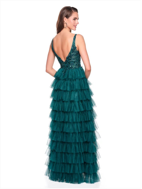 Model wearing Dave & Johnny Prom Dress Style 12635W in emerald green with tiered ruffle skirt and deep V back