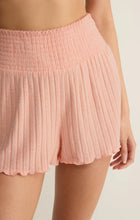 Close-up of textured light pink Z Supply Dawn Smocked Silky Rib Short showing smocked waistband and ribbed fabric