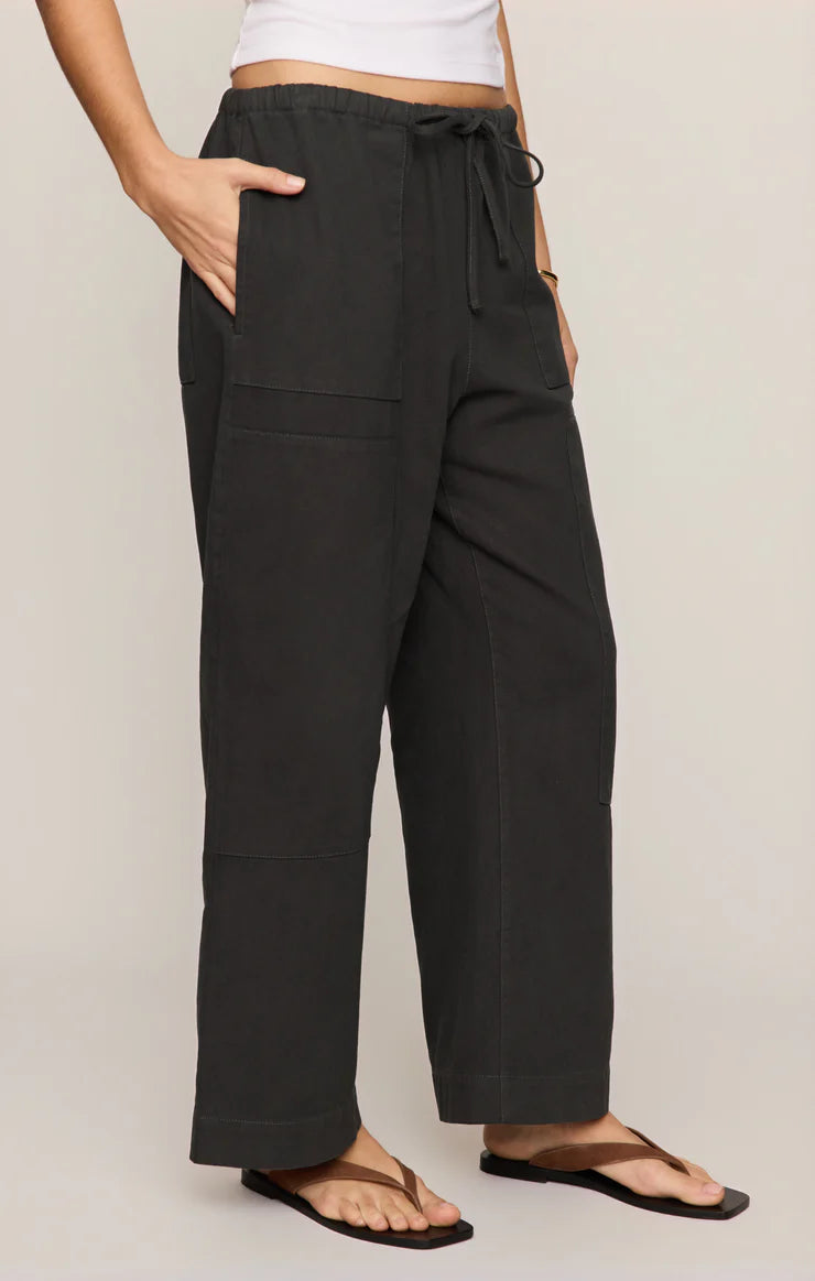 Model wearing black Z Supply Kit Twill Carpenter Pant with drawstring waist and relaxed fit pockets visible