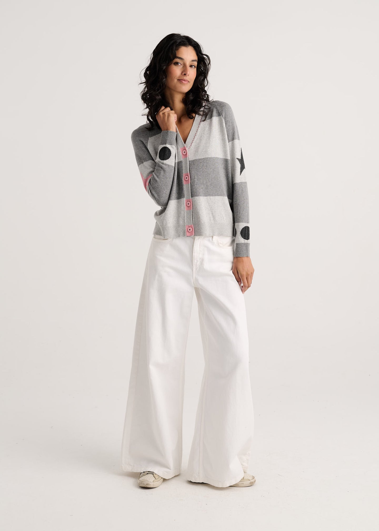 Marl Stripe Cardigan by zaket & plover styled with white wide leg trousers on a model