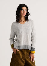 Heather Modern Easy V-Neck Sweater by zaket & plover in light gray, modeled with brown pants