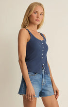 Woman wearing navy blue Z Supply Niko Scallop Rib Tank Top paired with denim shorts against neutral background