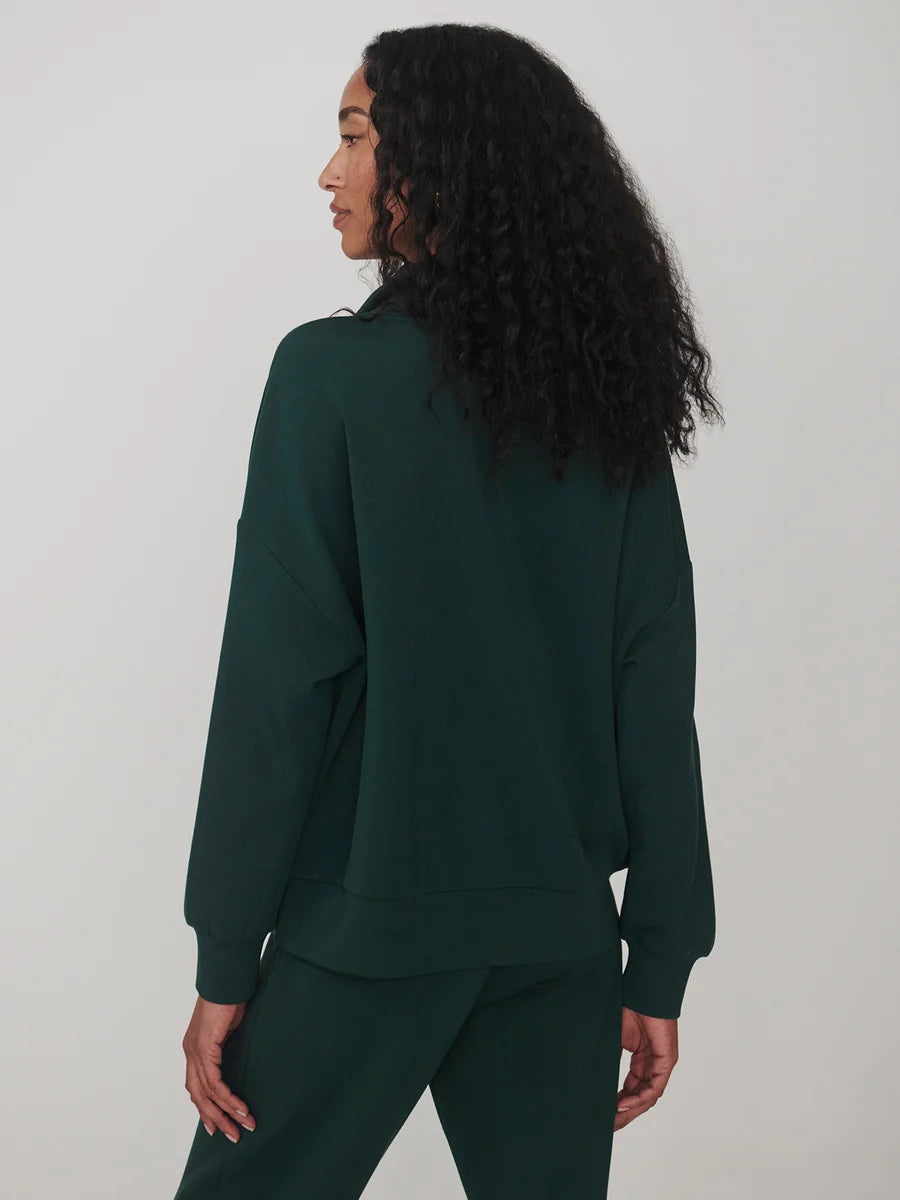 Varley Ponderosa Pine Hawley Half Zip Sweat in dark green worn with matching trousers shown from the back