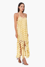 Model wearing Butter Yellow Opal Circle Radiance Dress by America & Beyond featuring large circular appliques and halter neck design