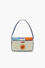 Sun & Sea Beaded Shoulder Bag by America & Beyond with colorful beaded sun and ocean design and navy strap.