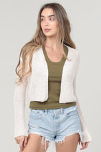 Woman wearing angie's Light Weight Flare Sleeve Cardigan over olive tank and denim shorts, casual spring outfit concept