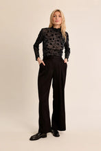 Molly Bracken Top in black floral lace with long sleeves worn by a model