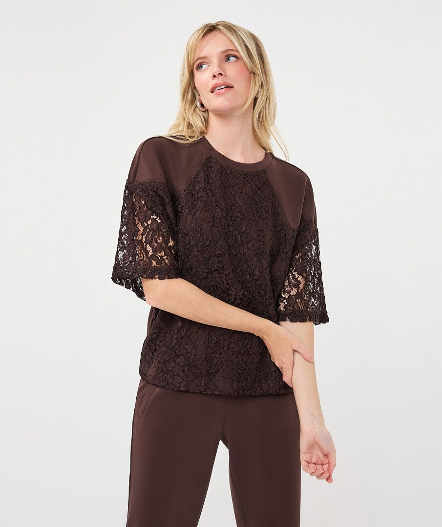 esqualo Cacao Modal Lace Top in brown with sheer lace sleeves modeled by a woman