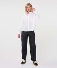 esqualo Off White Oversized Pocket Poplin Blouse modeled with wide leg jeans and sneakers