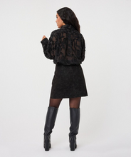 Black Faux Suede Skirt by esqualo modeled with black boots and a lace top