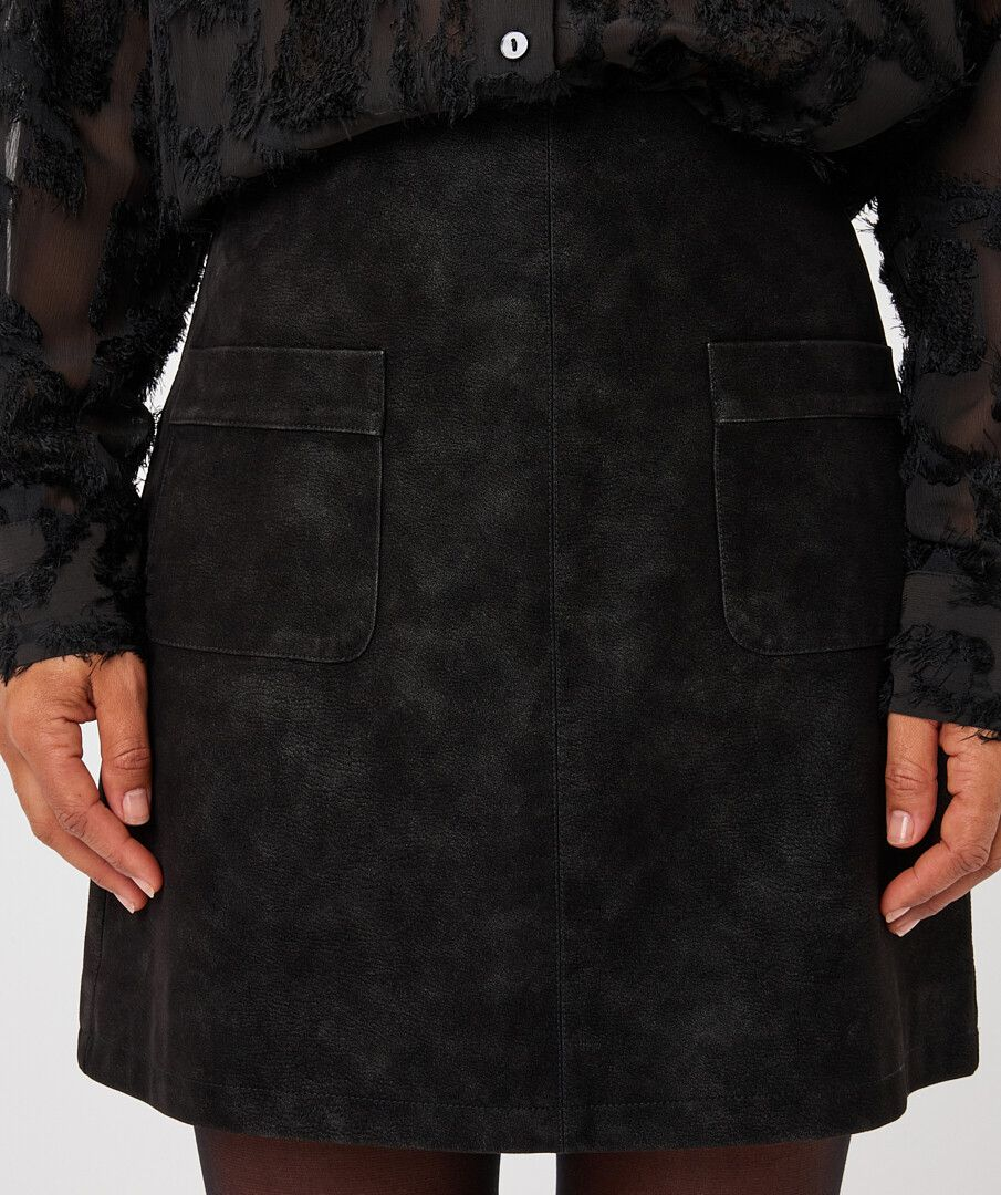 Black Faux Suede Skirt by esqualo with a straight silhouette and front patch pockets