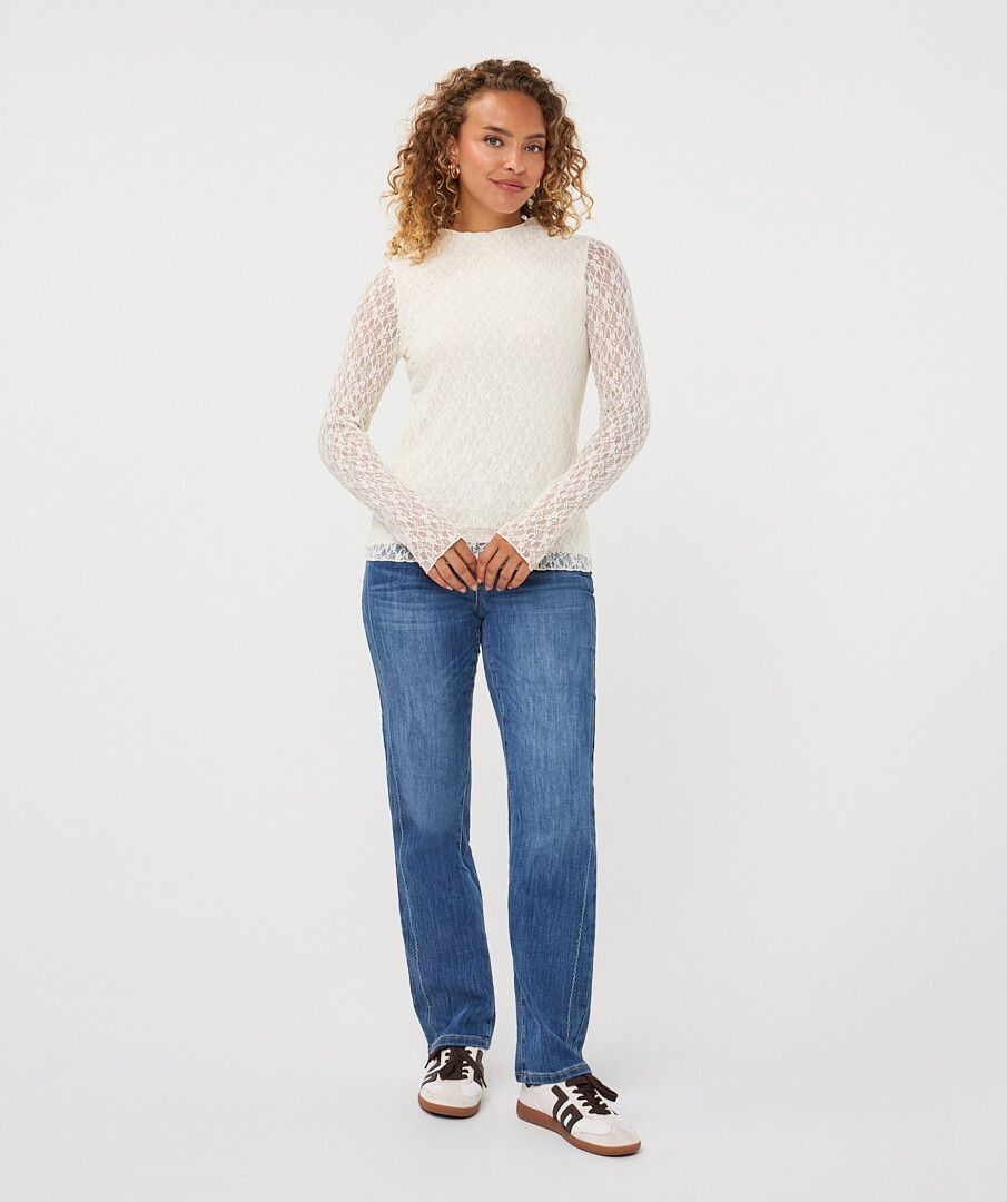 Off White Lace Top by esqualo with long lace sleeves styled with blue jeans and sneakers