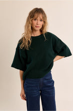 Molly Bracken Forest Knit Top in dark green styled with blue jeans on a model
