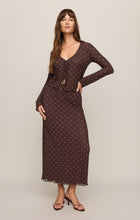 Woman wearing Dark Chocolate Eda Polka Dot Mesh Midi Skirt by z supply with long sleeve top and heels