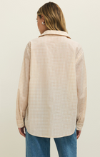 Back view of z supply Parchment Seaport Button Up Top in soft parchment gingham fabric paired with casual jeans
