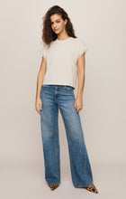 Woman wearing Cloud Marika Lace Trim Muscle Tee by z supply with wide-leg jeans and leopard print heels