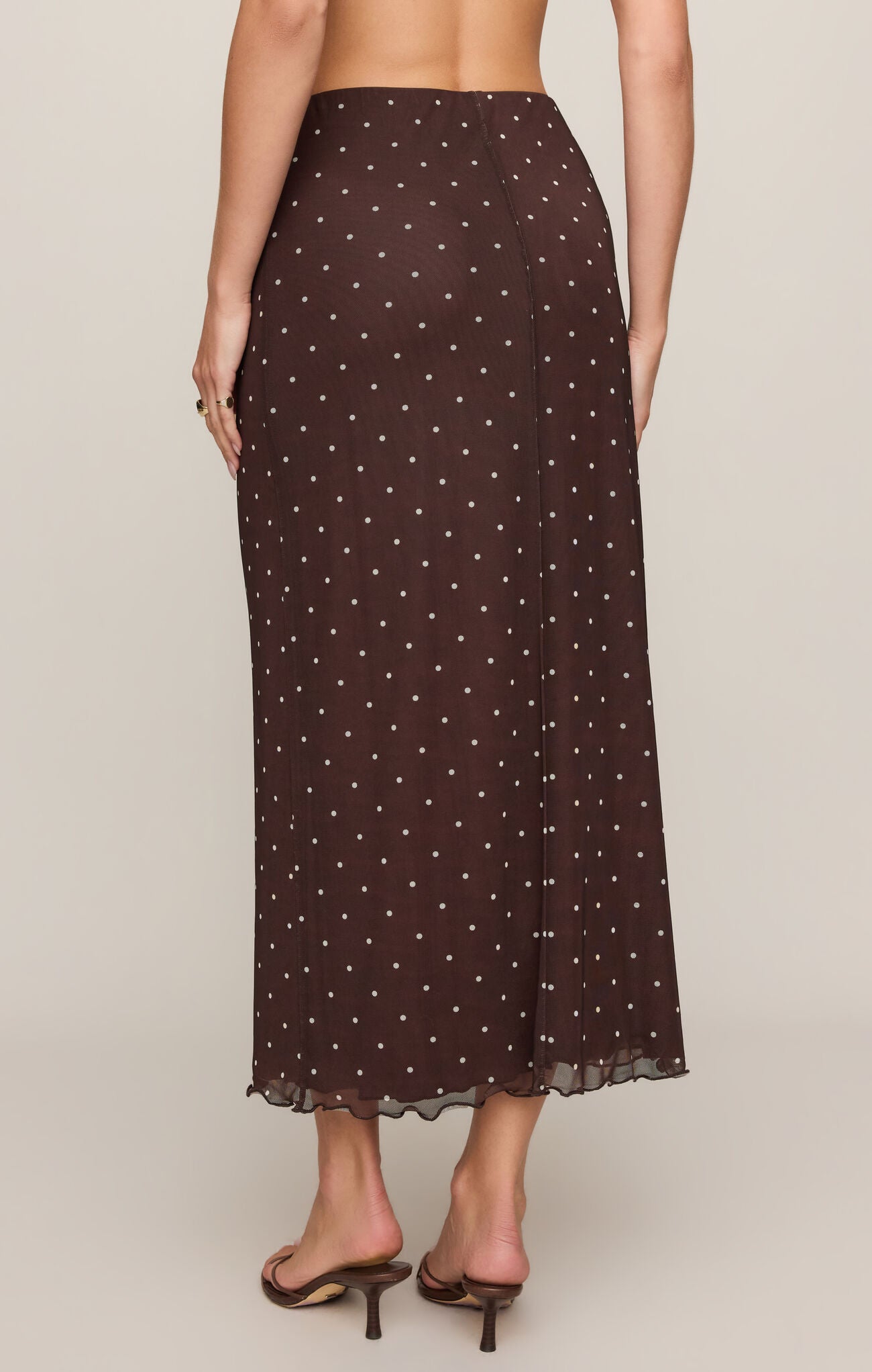 Dark Chocolate Eda Polka Dot Mesh Midi Skirt by z supply, sheer brown fabric with white polka dots, midi length back view.