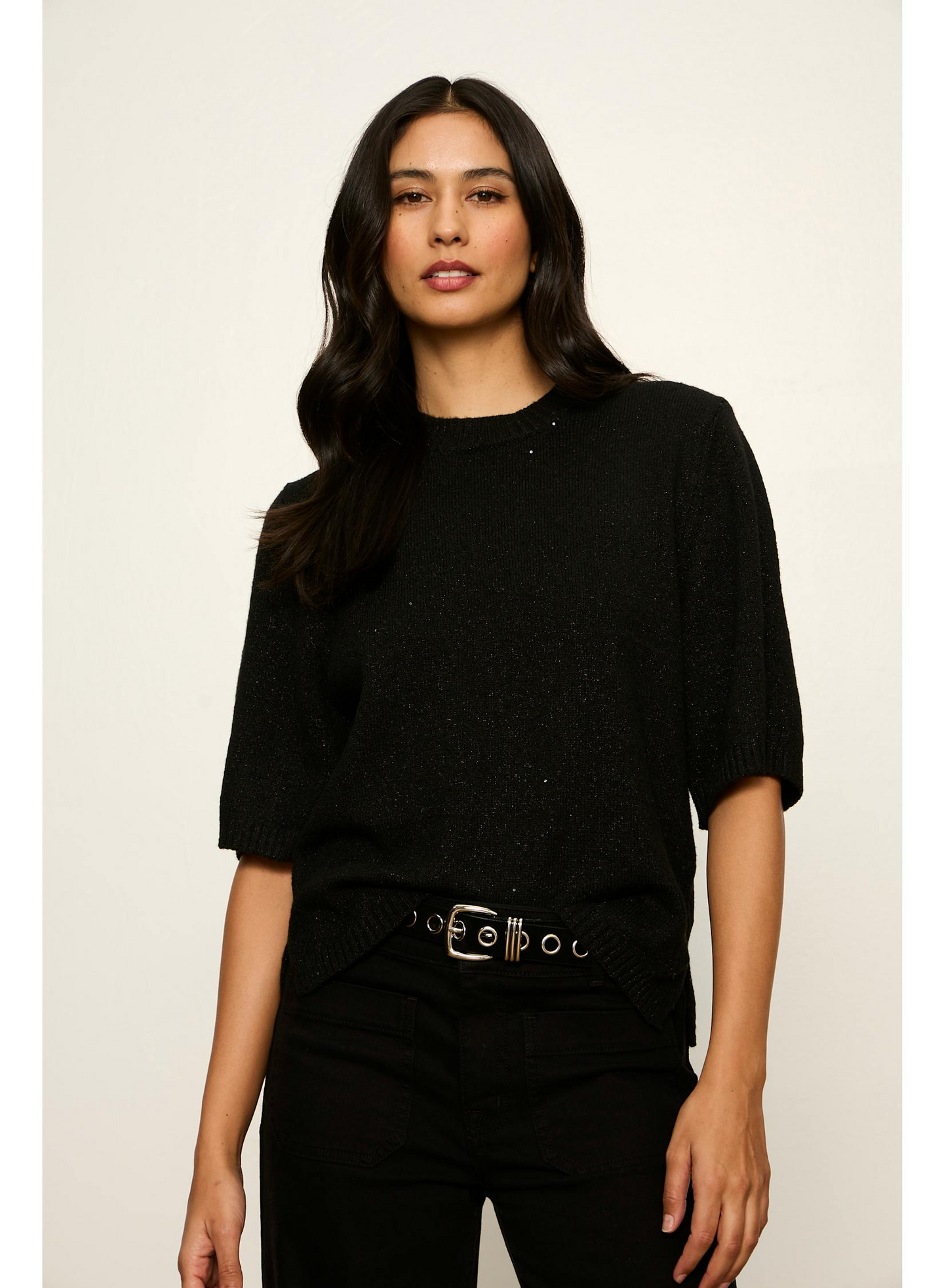 Woman wearing Sanctuary Black Perfect Sequin Sweater Tee with short sleeves and a round neckline in a casual pose