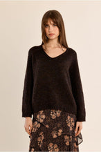 Molly Bracken Chocolate Sweater modeled with a floral skirt