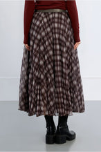 Chocolate Plaid Skirt by Molly Bracken shown on model in a long flowing plaid style with black platform boots