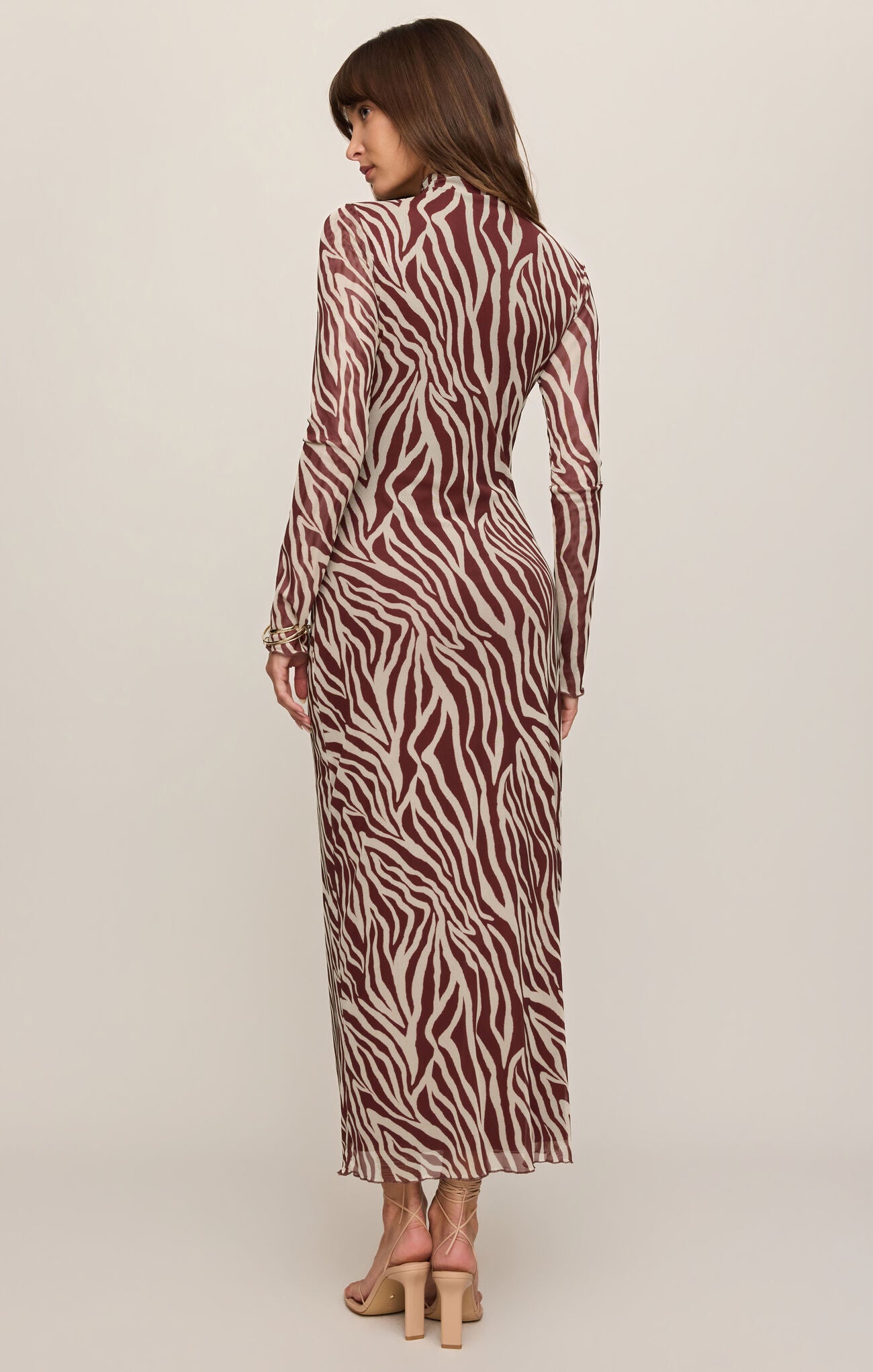 Back view of model wearing Velvet Rouge Sevilla Zebra Mesh Midi Dress by z supply in brown zebra pattern