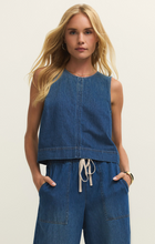 Woman wearing a classic indigo Deep Water Sun Seeker Denim Tank by z supply with sleeveless crew neck style