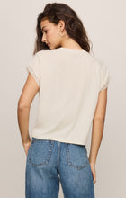 Woman wearing an off-white Cloud Marika Lace Trim Muscle Tee by z supply with lace details on sleeve edges shown from back
