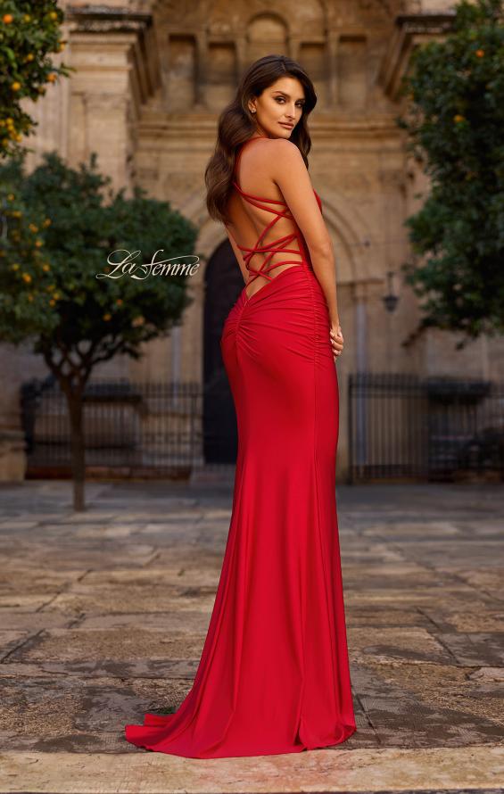 La Femme Prom Dress Style 33723 red gown with an open back and crisscross straps in size 4 on model outdoors