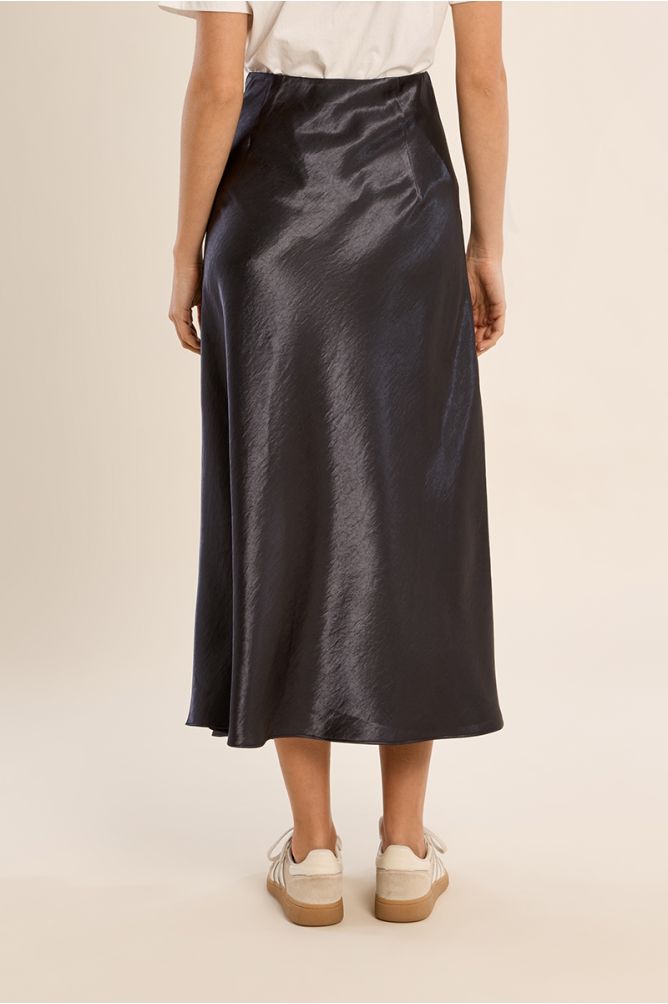Gun Metal Skirt by Molly Bracken shown in a glossy dark midi style
