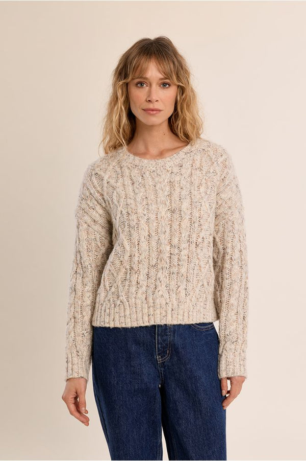 Molly Bracken Off White Cable Sweater worn with dark jeans