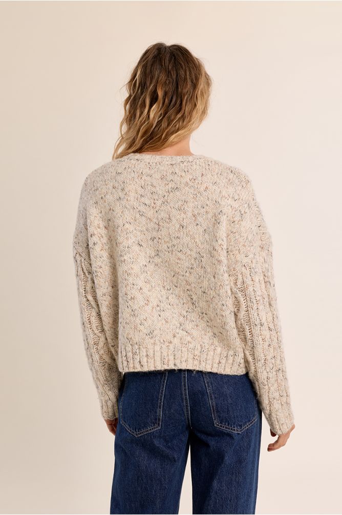 Molly Bracken Off White Cable Sweater viewed from the back with textured knit and blue jeans