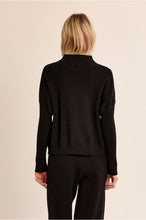 Molly Bracken Black Modern Knit Sweater shown from the back with ribbed collar cuffs and hem
