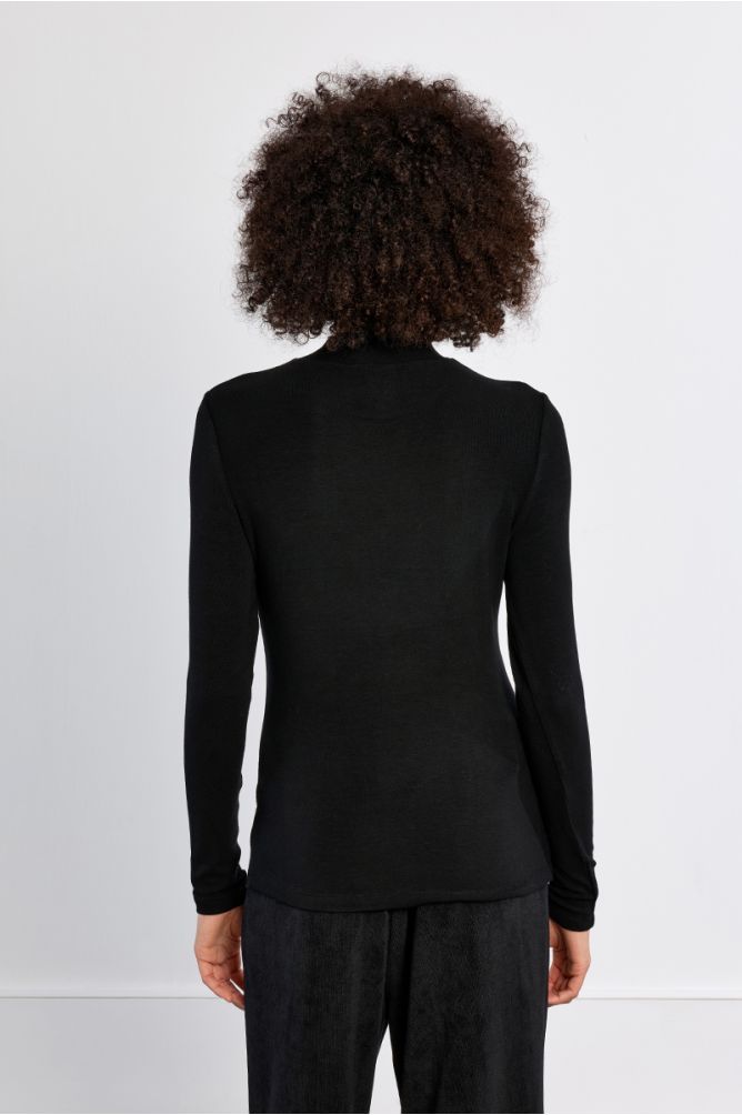 Molly Bracken Whisper Top in black shown from the back on a model