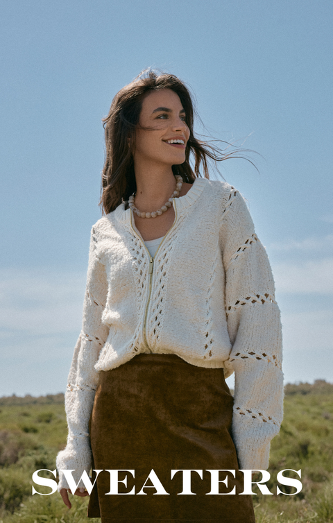 Gold and pearl beaded bracelets on a wrist with 'ENEWTON' branding.