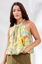 Woman modeling Tribal Kiwizest Print Bubble Hem Blouse with tropical pattern and gathered halter neckline by Tribal