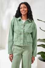 Smiling woman wearing Tribal Comfort Stretch Denim Button-Front Jacket in light green paired with matching pants