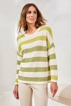 Woman wearing Tribal Kiwizest Crew Neck Drop Shoulder Sweater in green and cream stripes with beige pants