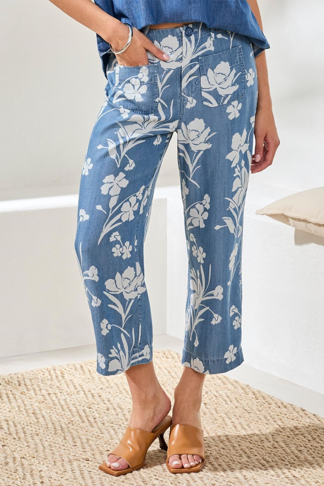 Front view of Tribal Denim Printed Wide Leg Crop Pant with white floral print styled with tan heeled slides