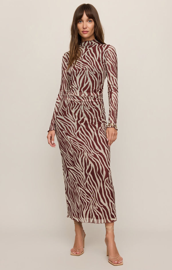 Model wearing a Zebra print Velvet Rouge Sevilla Zebra Mesh Midi Dress by z supply with long sleeves and high neckline