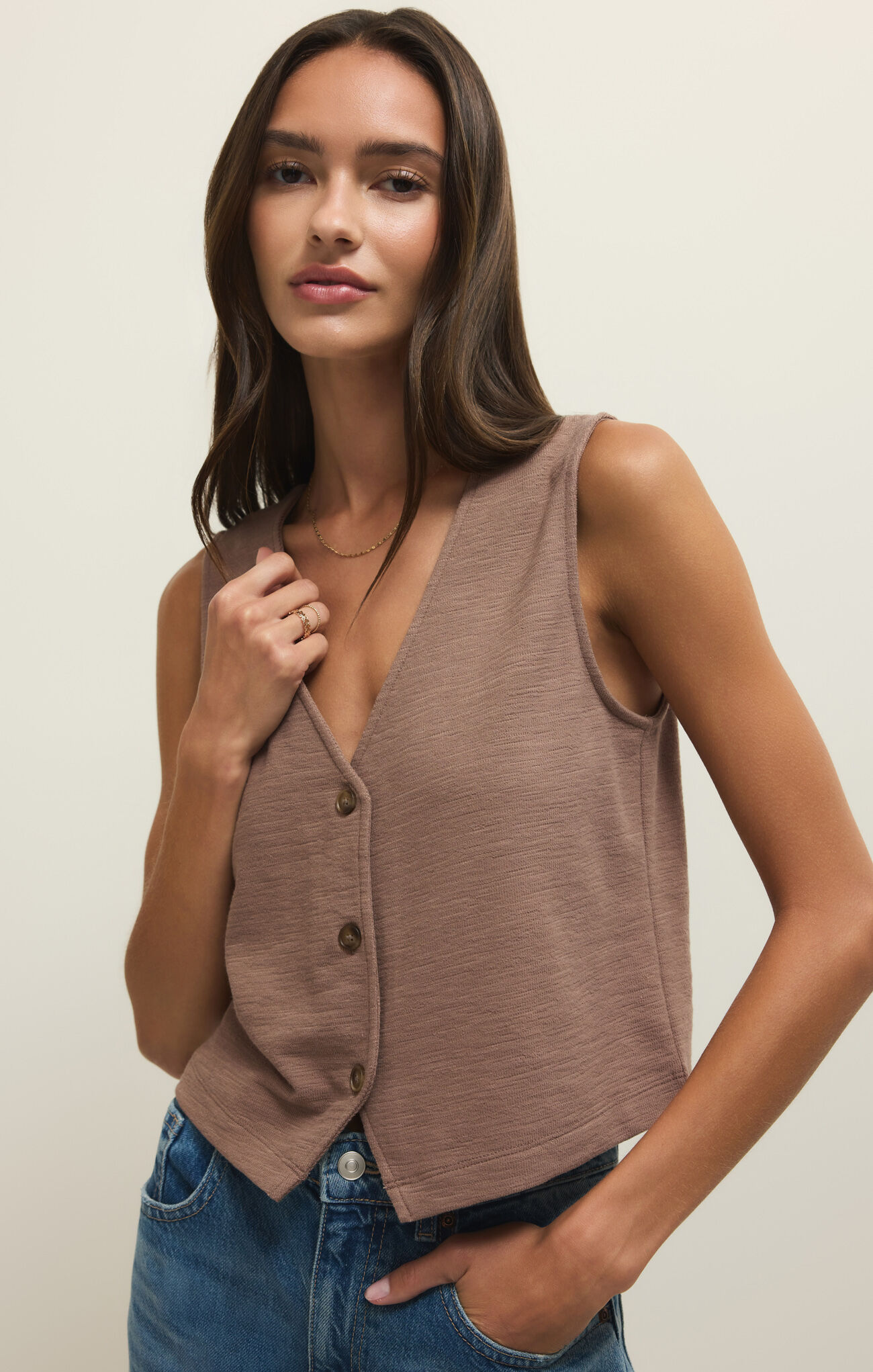 Woman wearing a brown Z Supply Milk Shake Noelle Textured Tank Top with buttons and textured fabric detail