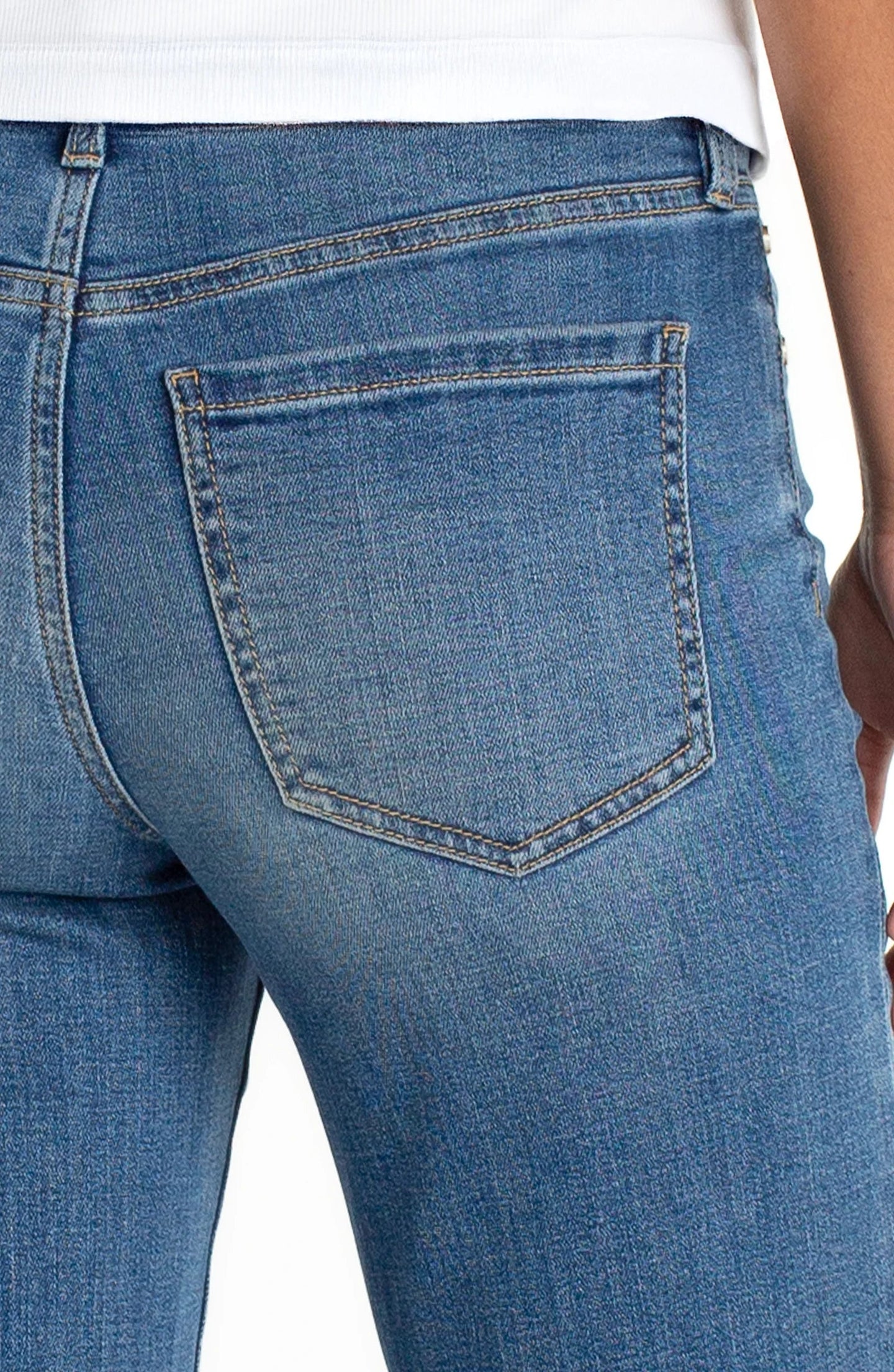 Close-up of back pocket detail on Newport Beach Kennedy Crop Straight w/ Blind Hem 28 Inseam jeans by liverpool in blue denim