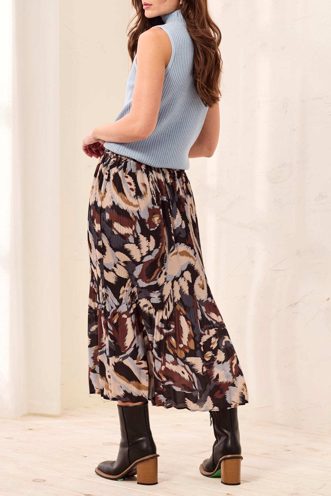 Tribal Printed Skirt by Tribal with an abstract multicolor pattern styled with a blue sleeveless top and boots