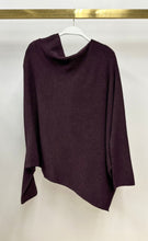 Milio Milano plum asymmetrical knit sweater on a hanger