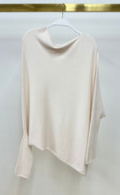 Milio Milano ivory asymmetrical knit sweater on a hanger